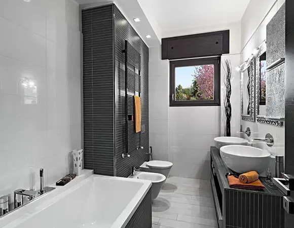 Modern bathroom with bath, bidet and twin basins