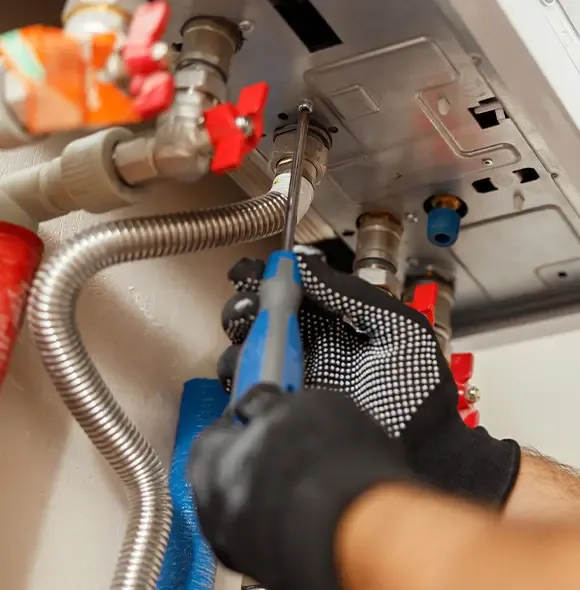 Engineer servicing a boiler